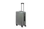 24 inch silver hard shell luggage with fine vertical ribs, side view with four wheels