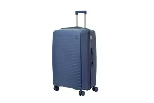 28 inch dark blue hard shell luggage with fine horizontal ribs and a small round badge, side view with four wheels