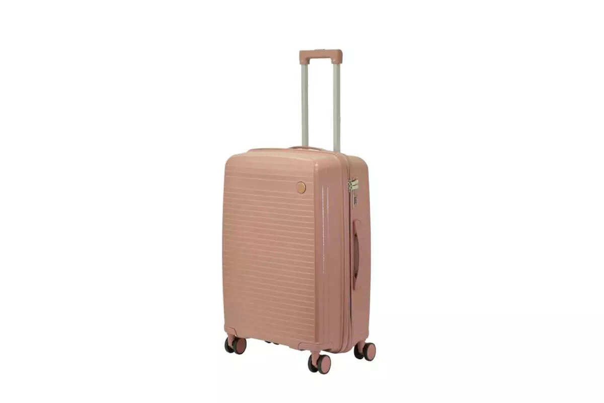 24 inch rose gold hard shell luggage with fine horizontal ribs and a small round badge, side view with four wheels