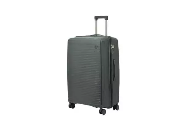28 inch dark grey hard shell luggage with fine horizontal ribs and a small round badge, side view with four wheels